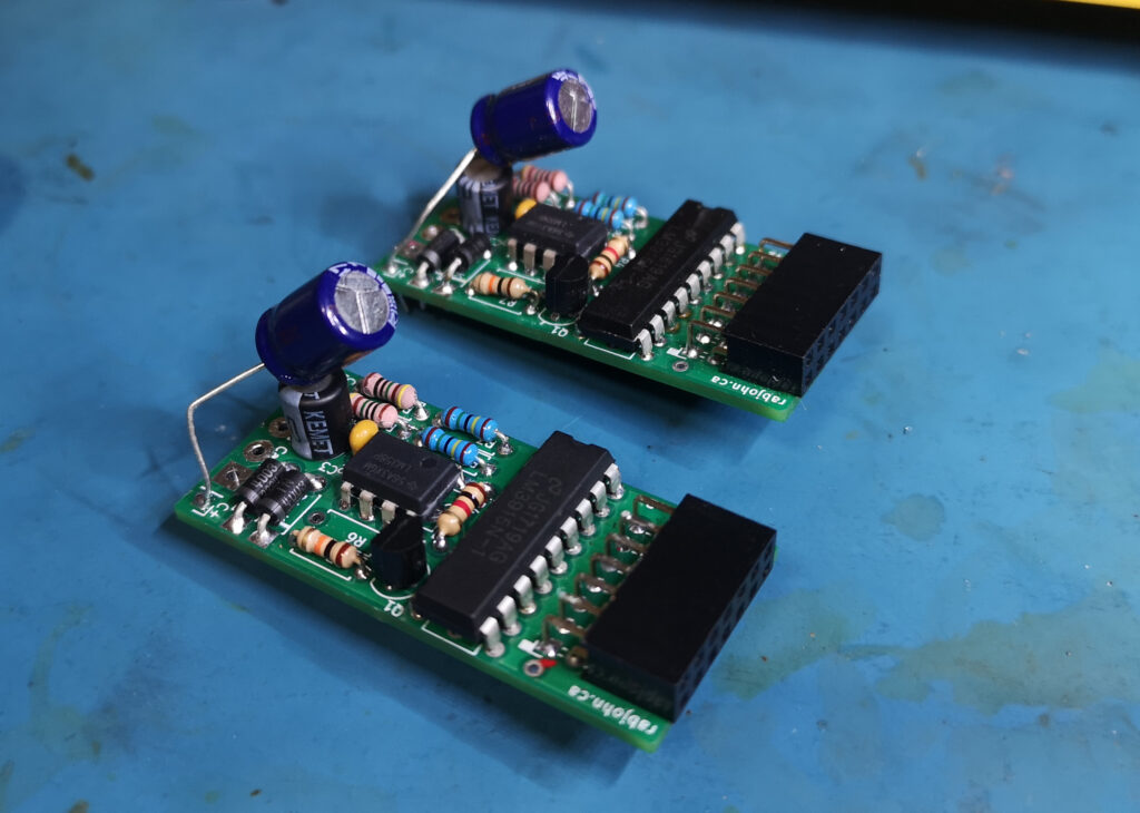 Pair of hand-soldered PCBs with electronic components